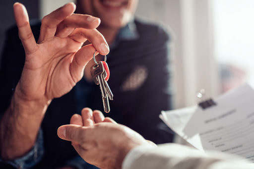 Picture of handing over the keys to the residence.